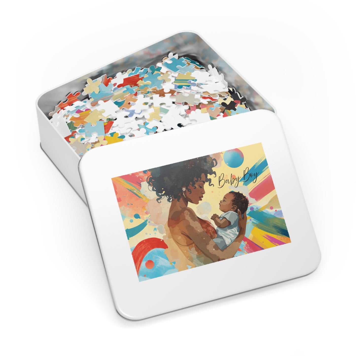 Jigsaw puzzle in a tin box with an illustration of a woman holding a baby on the lid.