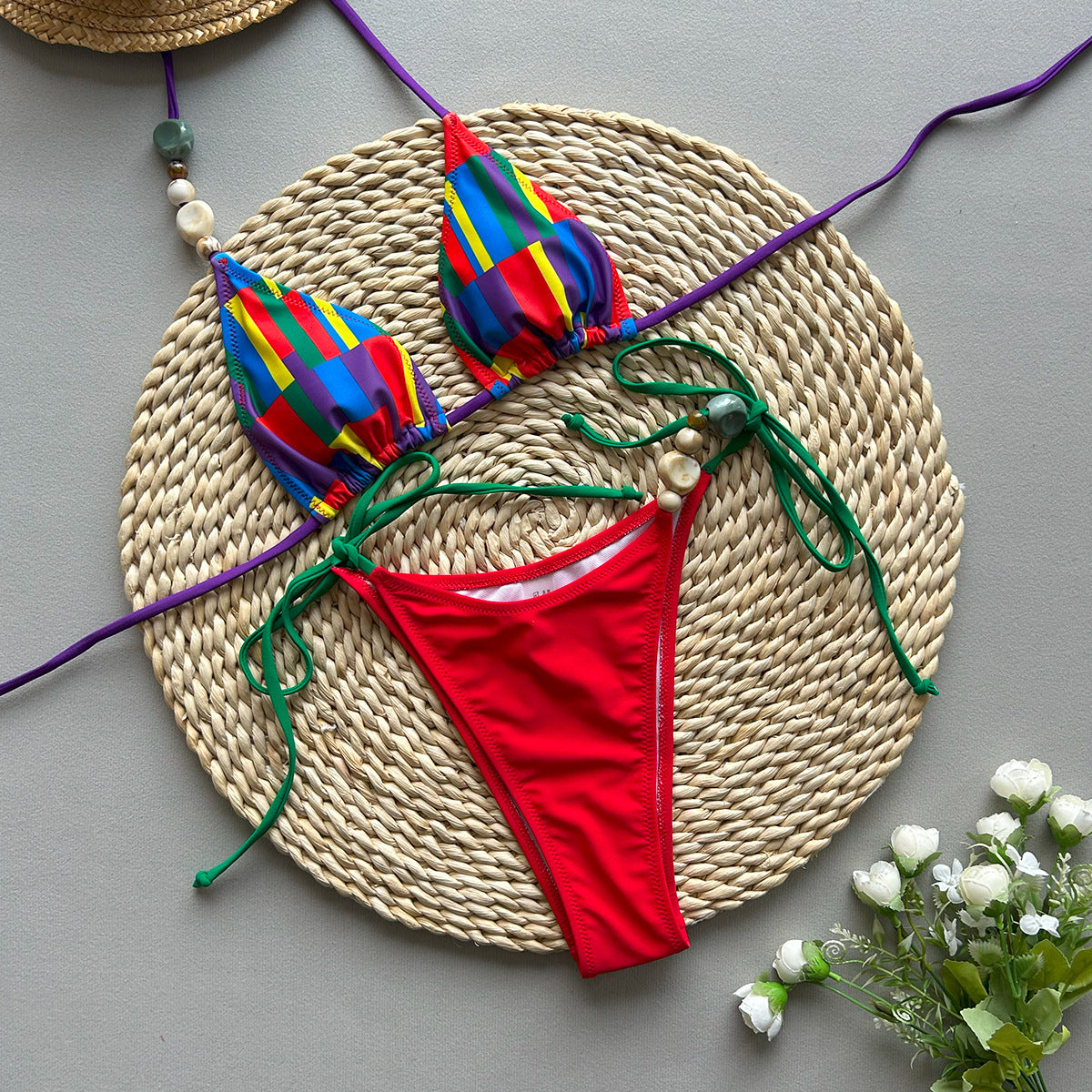 Two‑piece women’s bikini set in black or red spliced solid‑color design, featuring a sleeveless triangle top and high‑elasticity fitted bottoms.