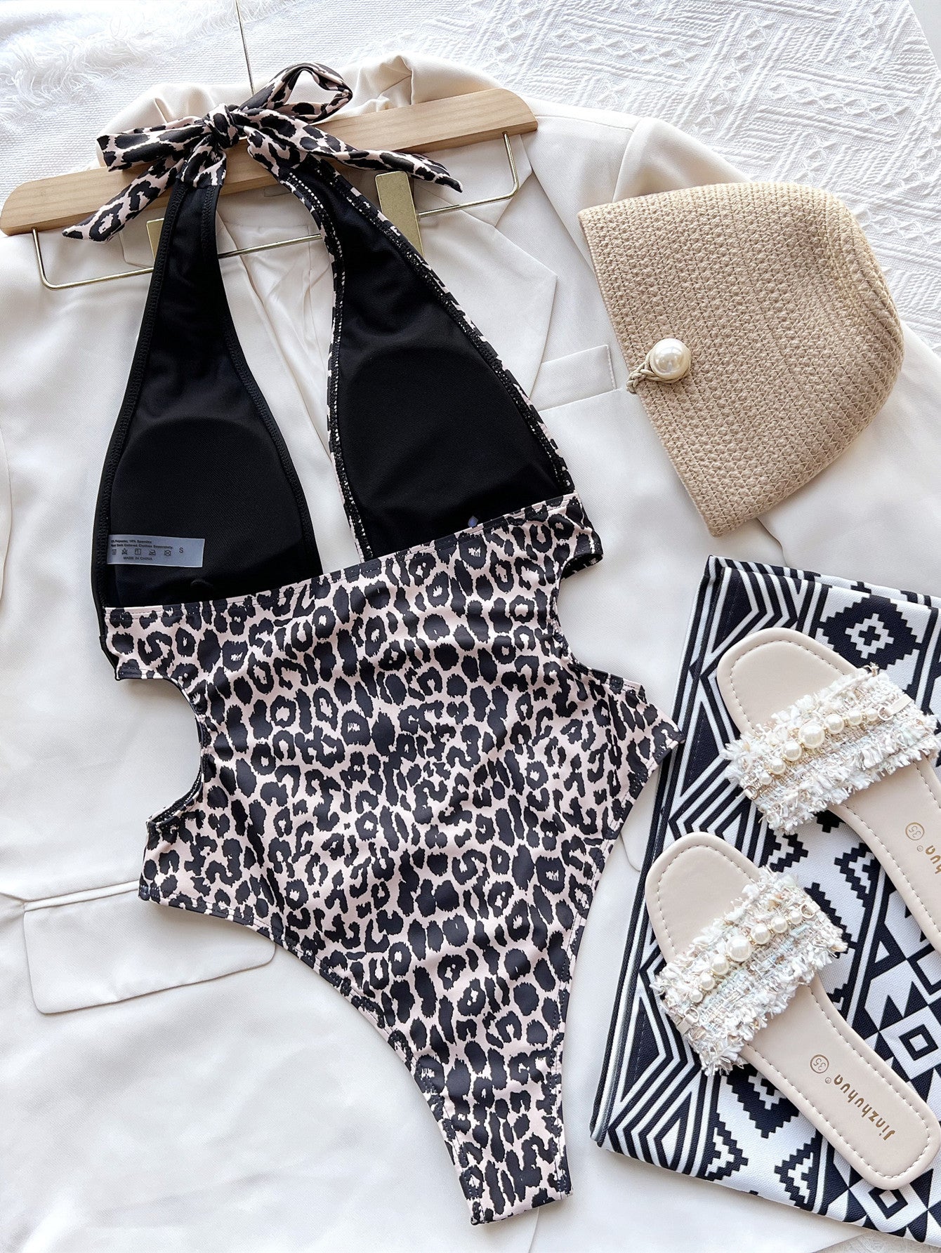 Leopard‑print patchwork swimsuit.