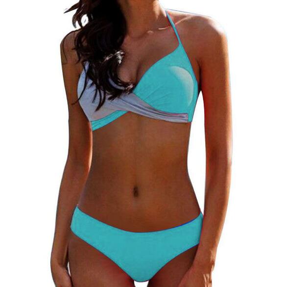 Two‑piece women’s bikini set featuring a padded push‑up top with spaghetti straps and a low‑waist patchwork bikini bottom, displayed in a flat lay on a neutral background.
