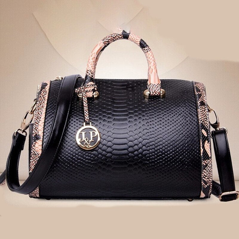 Women’s luxury faux‑leather snakeskin crossbody handbag with top handle and shoulder strap.