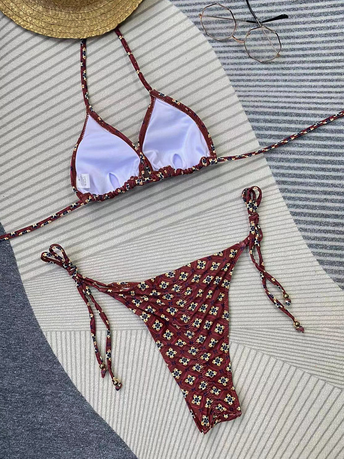 Bikini set with floral pattern on a striped fabric background