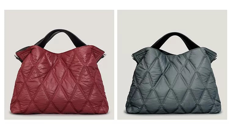 Two quilted handbags, one red and one gray, on a light beige background.
