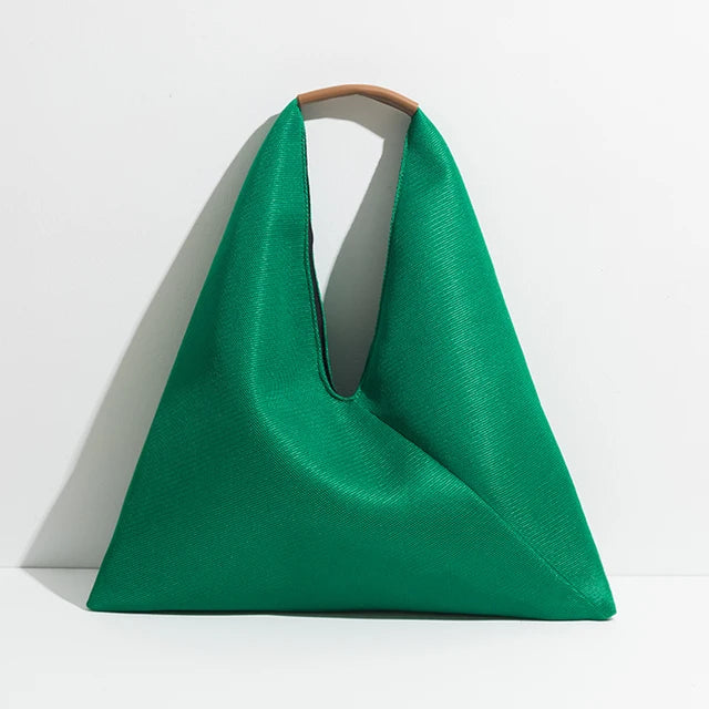 Green triangular bag with handle on a white background