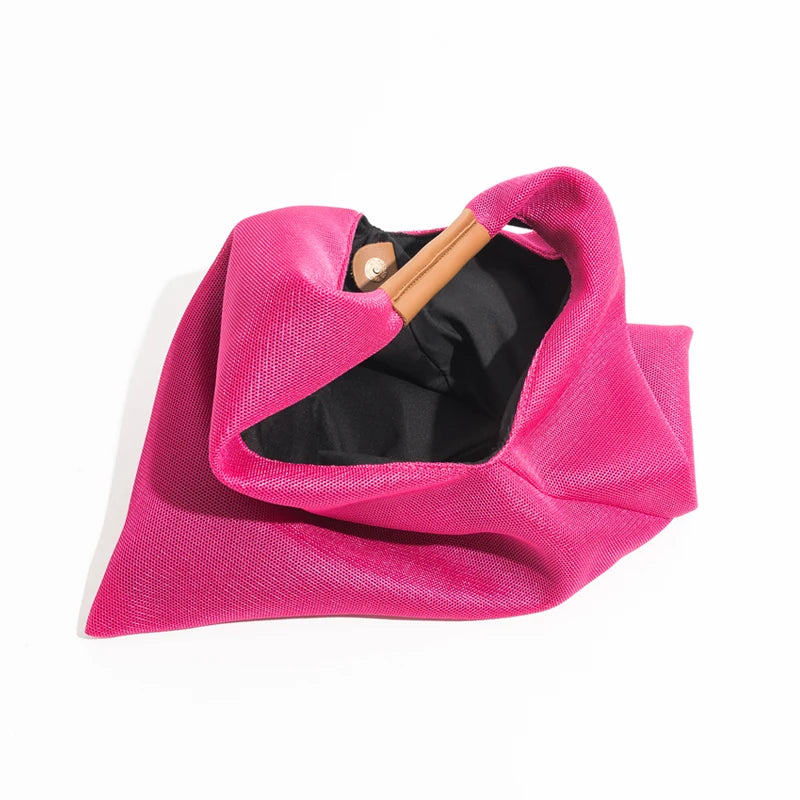 Pink handbag tote with handle on a white background