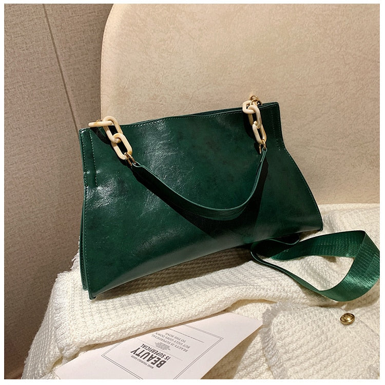 Large women's shoulder bag in soft faux leather, front view showing smooth finish and slim silhouette, black variant. Sold at PeachyBeanz.