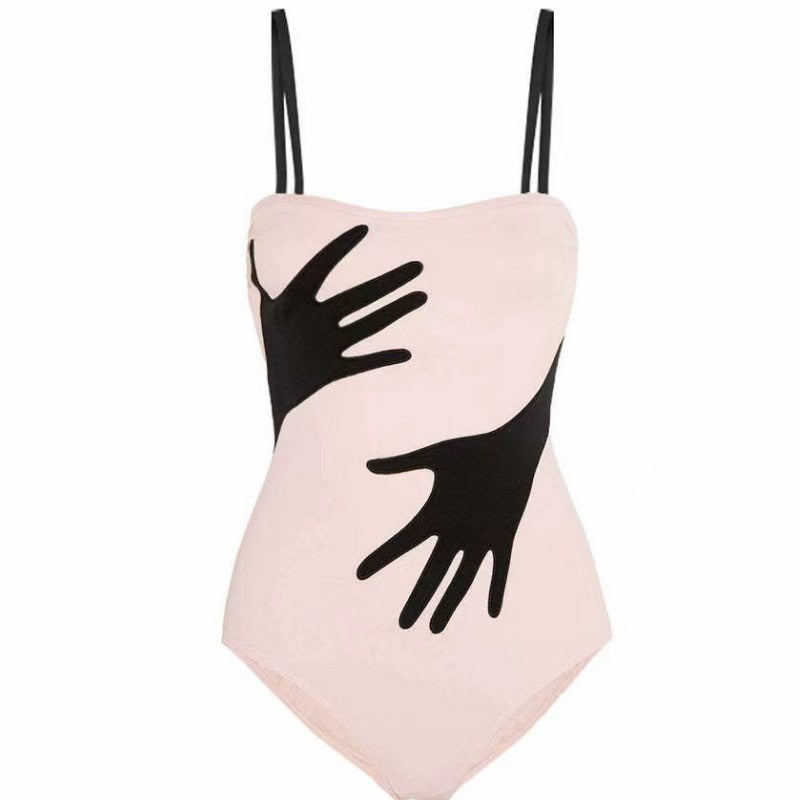 Black and white swimsuit sold at PeachyBeanz.