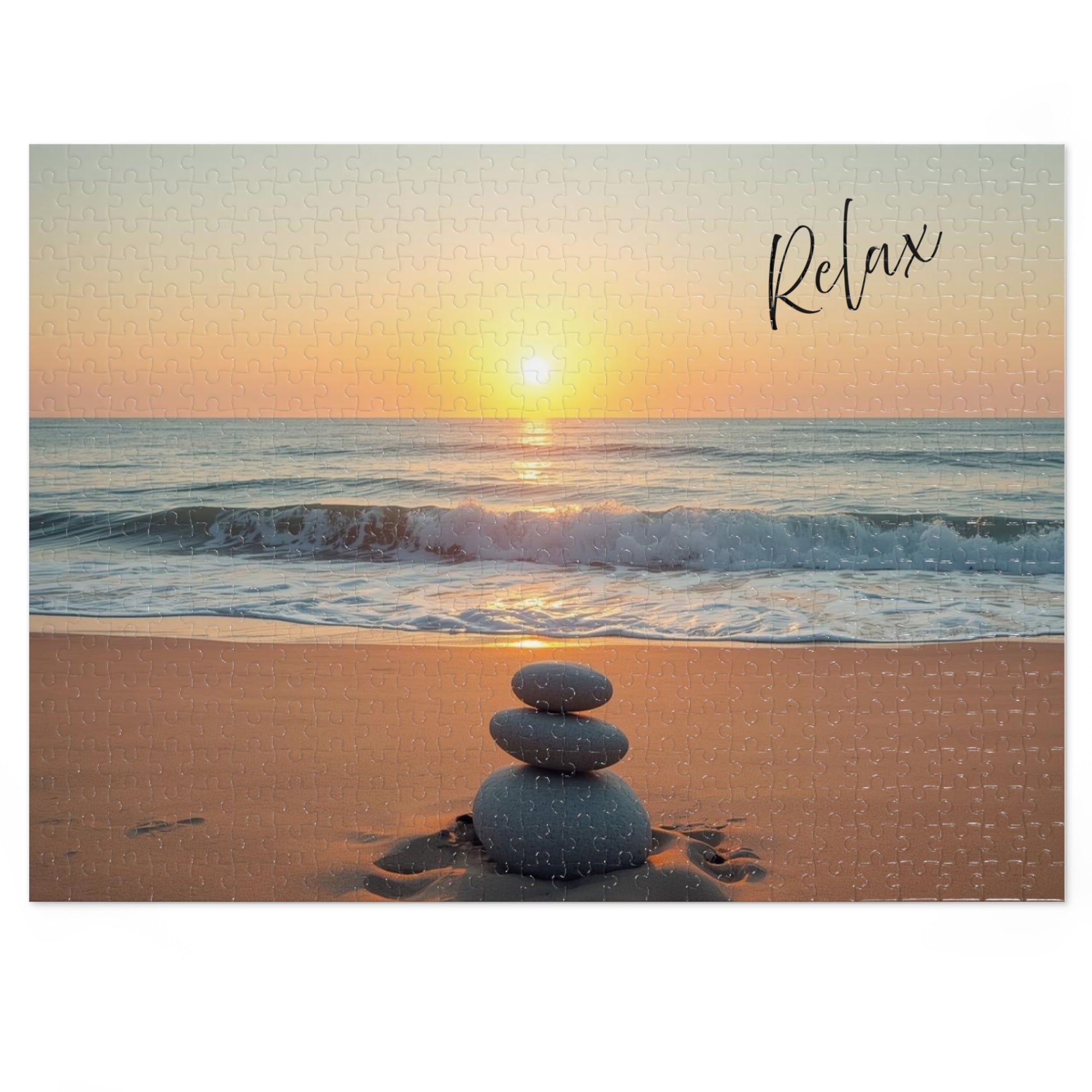 Sunset on a beach with stacked stones and 'Relax' text