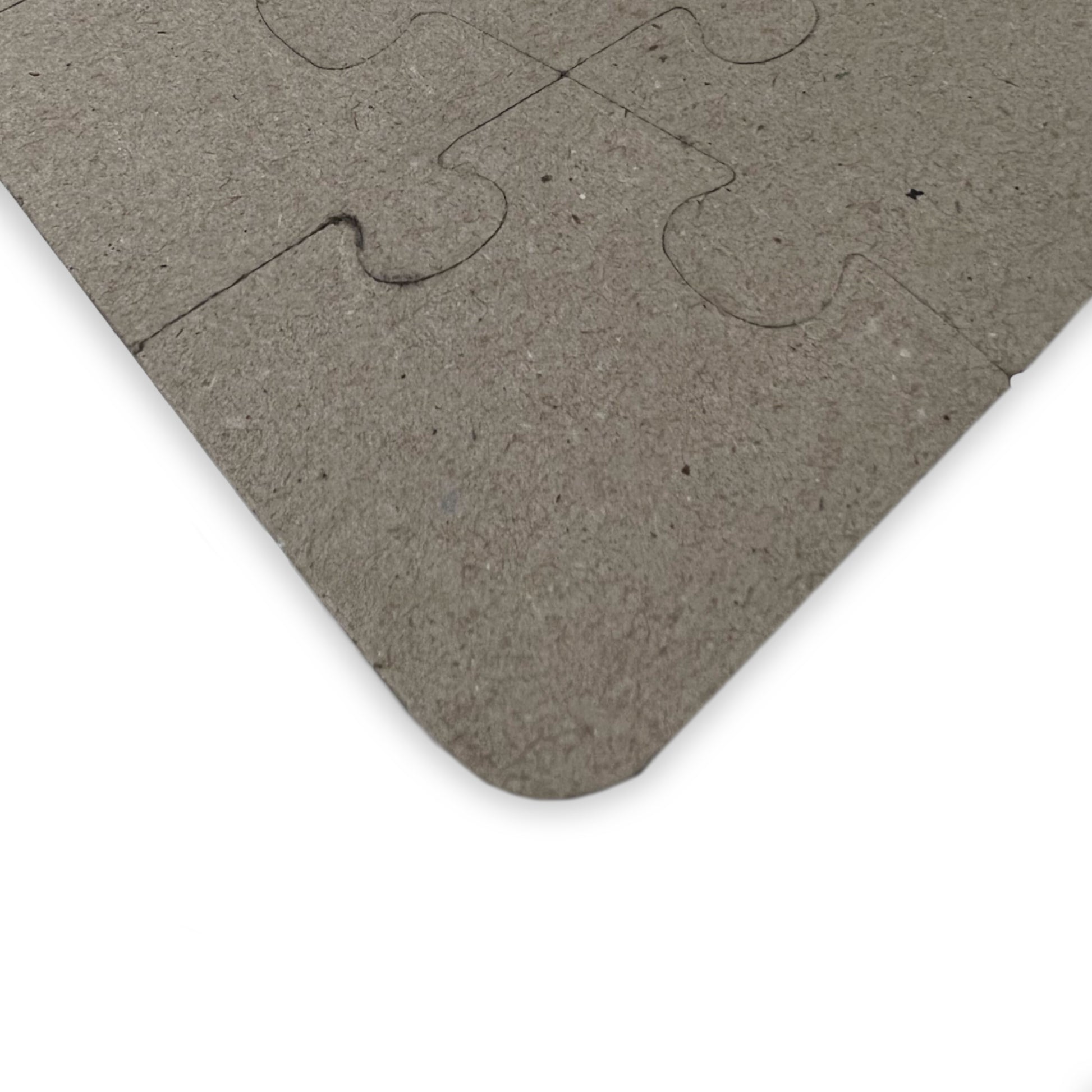 Gray puzzle piece on a white background