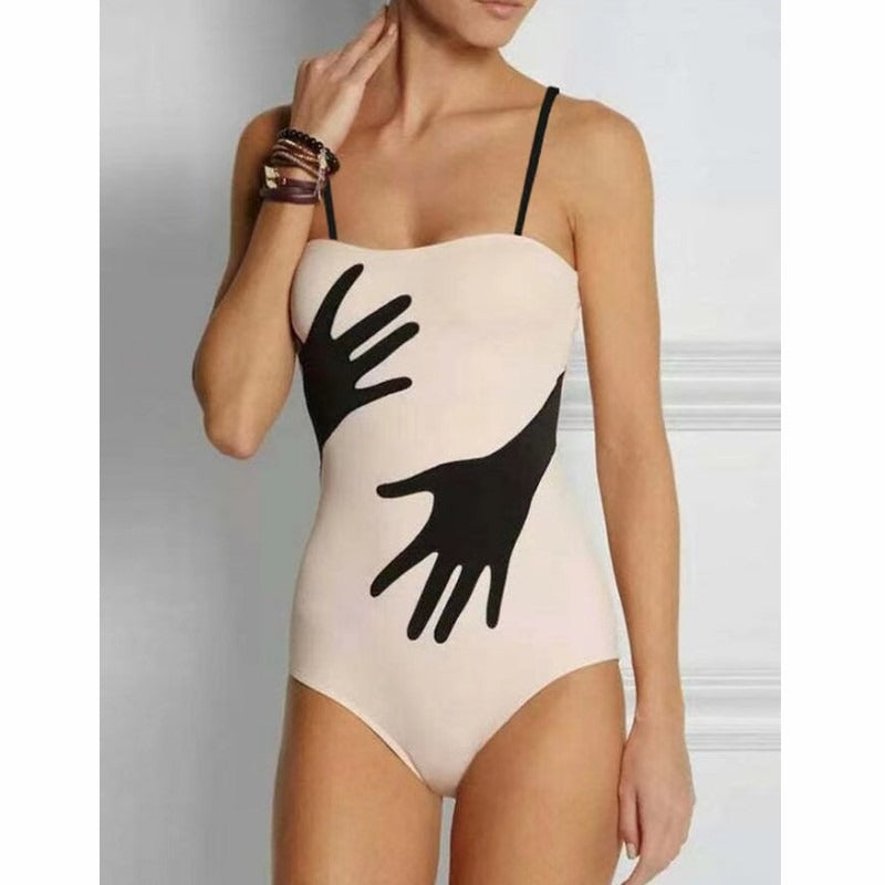 Black and white swimsuit sold at PeachyBeanz.