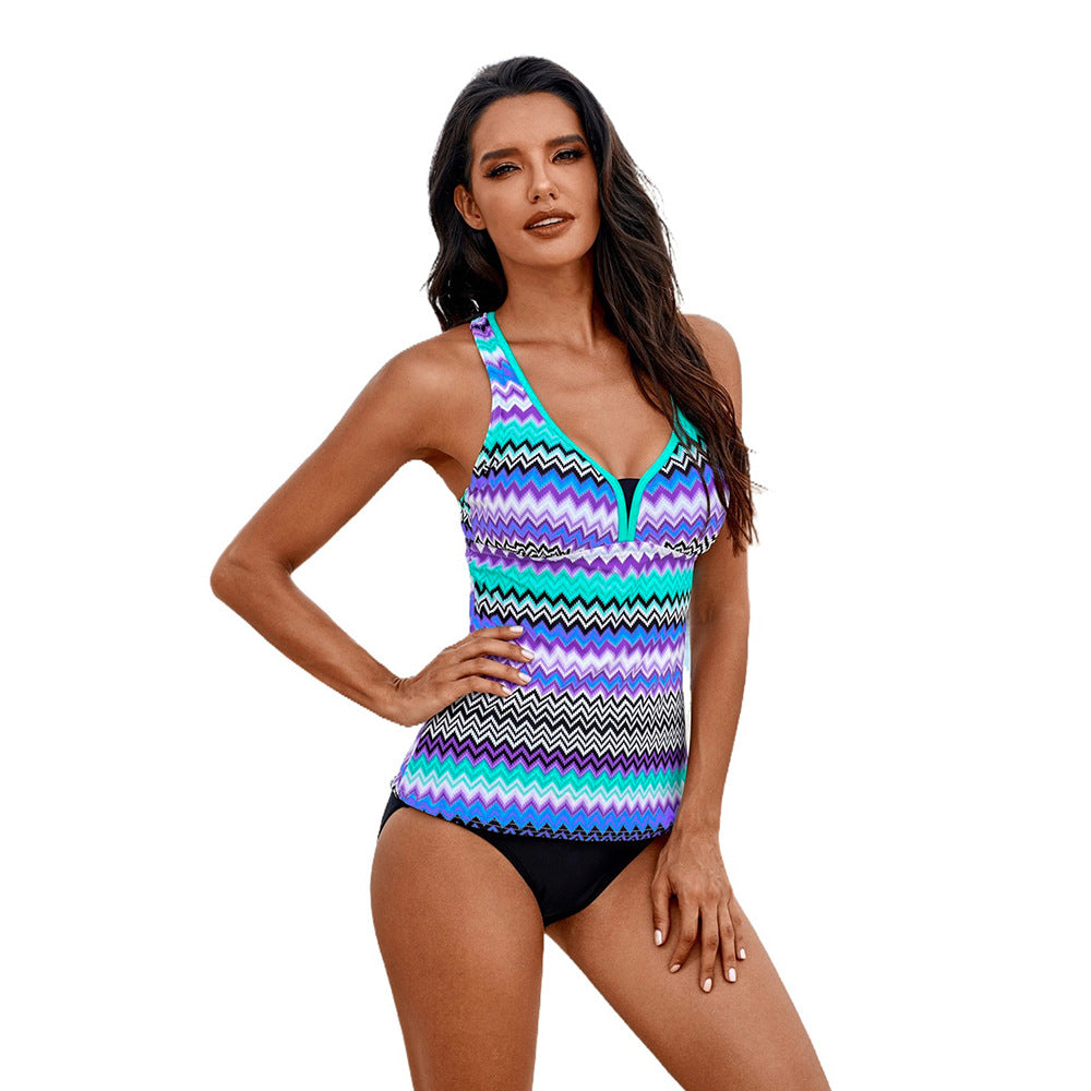 Woman wearing a colorful zigzag patterned swimsuit sold at PeachyBeanz.