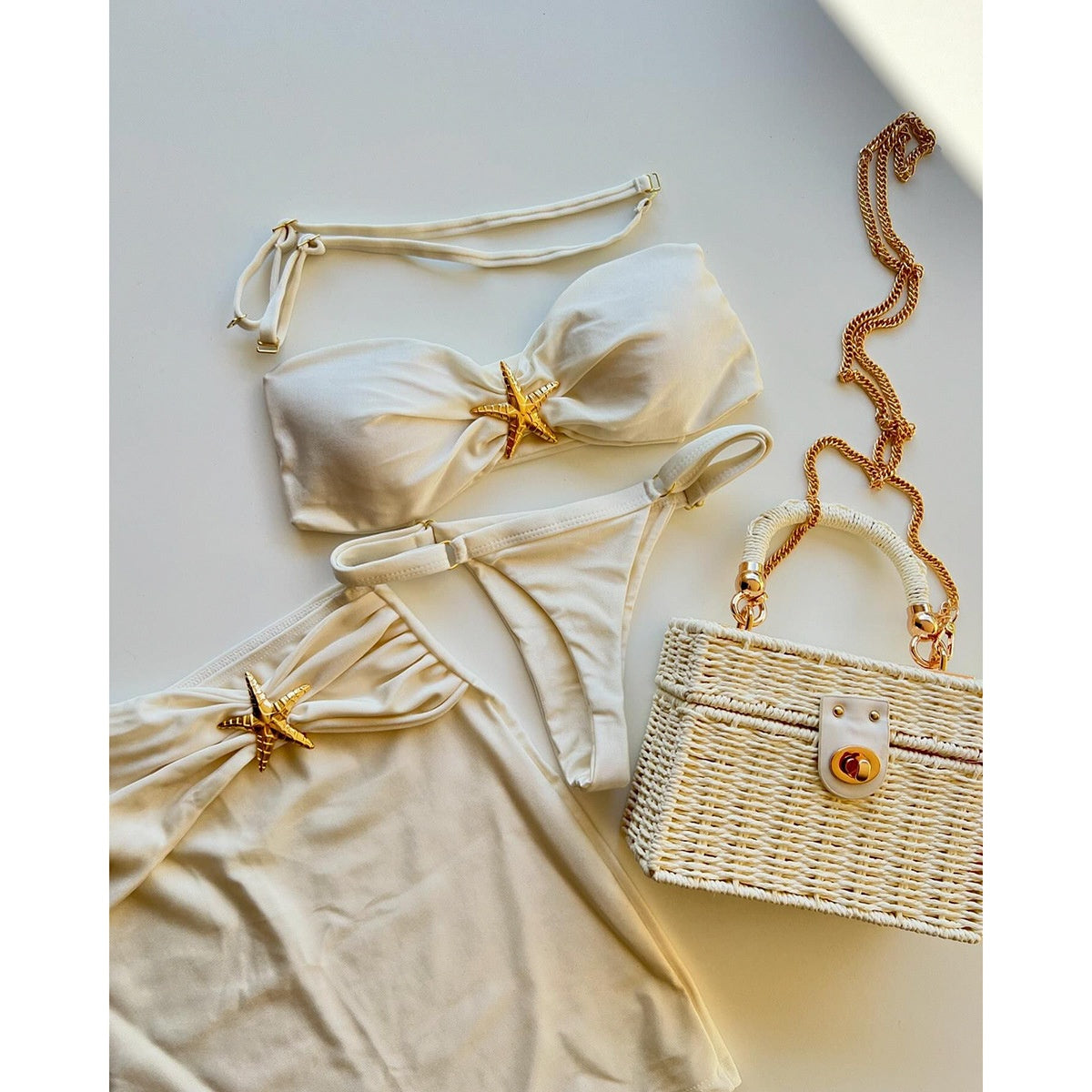 Bikini set with starfish decorations on a light gray 