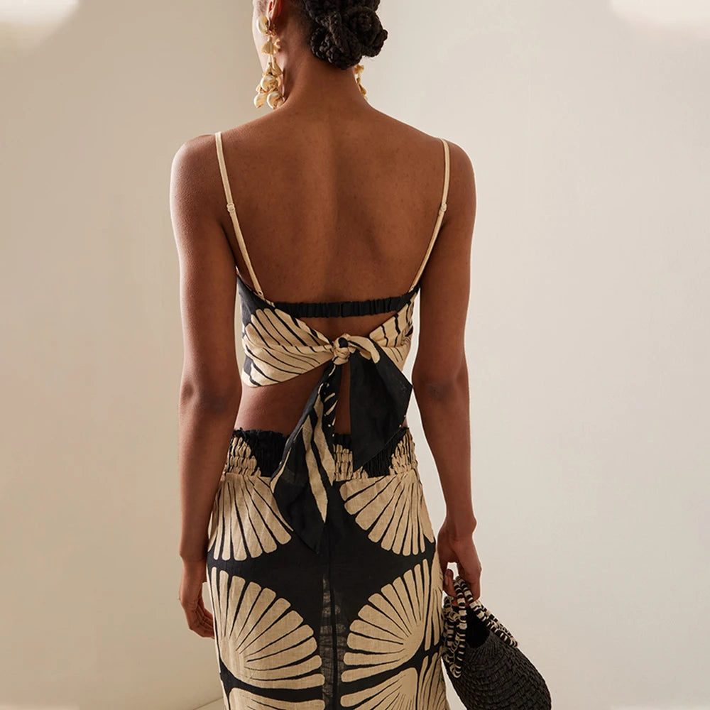 Woman wearing a swimsuit coverup top and skirt sold at PeachyBeanz