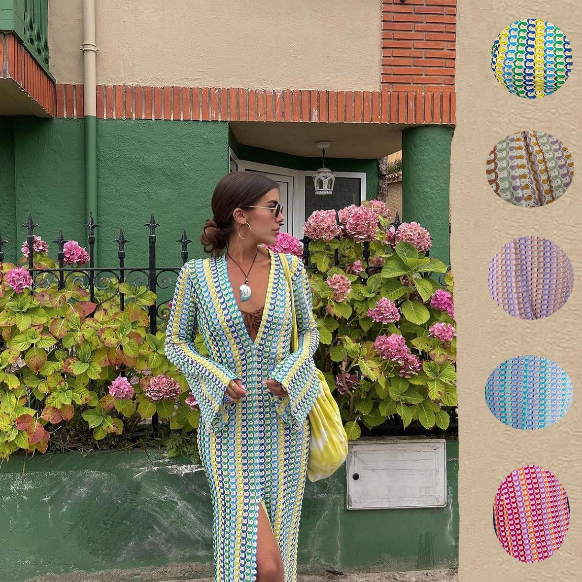 Person standing in a colorful dress cover-up with a patterned design.