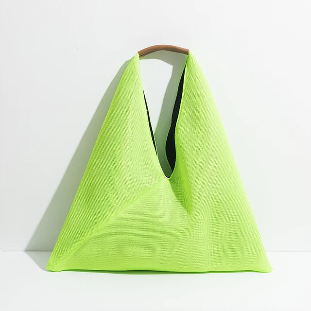 Neon green bag with a brown handle on a white background