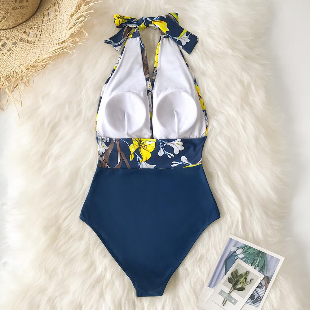 Blue mist floral one‑piece swimsuit with a backless design, sleeveless cut, and lightweight quick‑dry fabric.