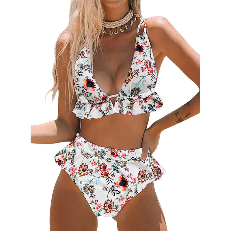 Women wearing a two-piece tropical bikini with a white background