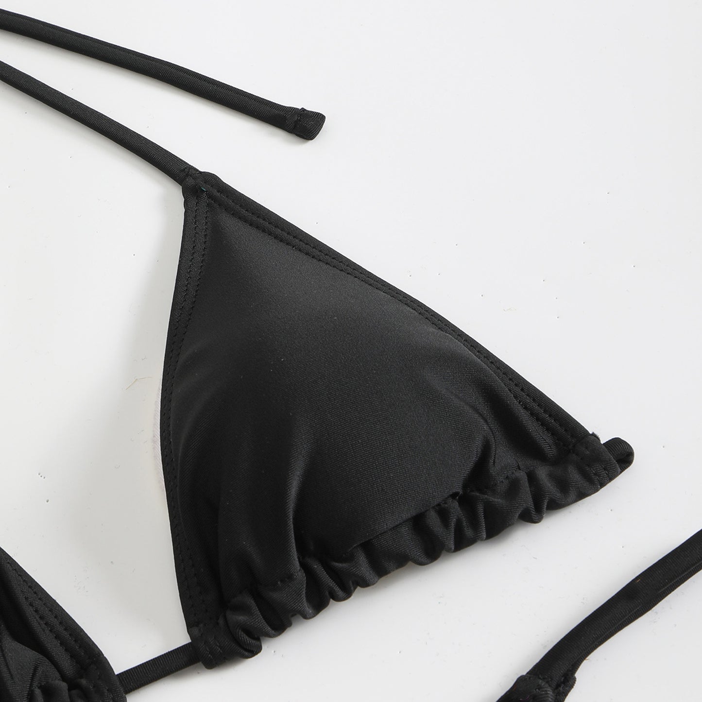 Black swimsuit top sold at PeachyBeanz.