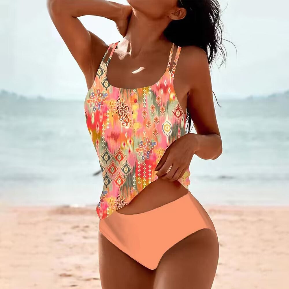 Two‑piece women’s tankini set featuring a sleeveless spaghetti‑strap top and high‑waisted bottoms, displayed in a solid color on a white background.
