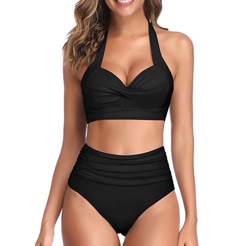 Woman wearing a solid design swimsuit against a white background.