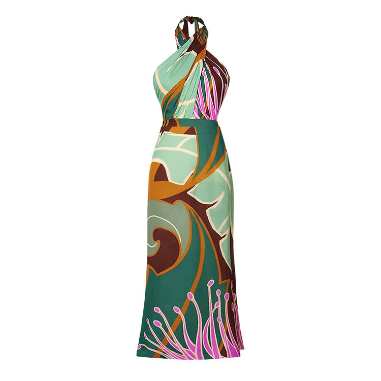 Halter printed one‑piece swimsuit with matching wrap skirt; plaid floral print in soft blue and brown, shown on neutral background. 
