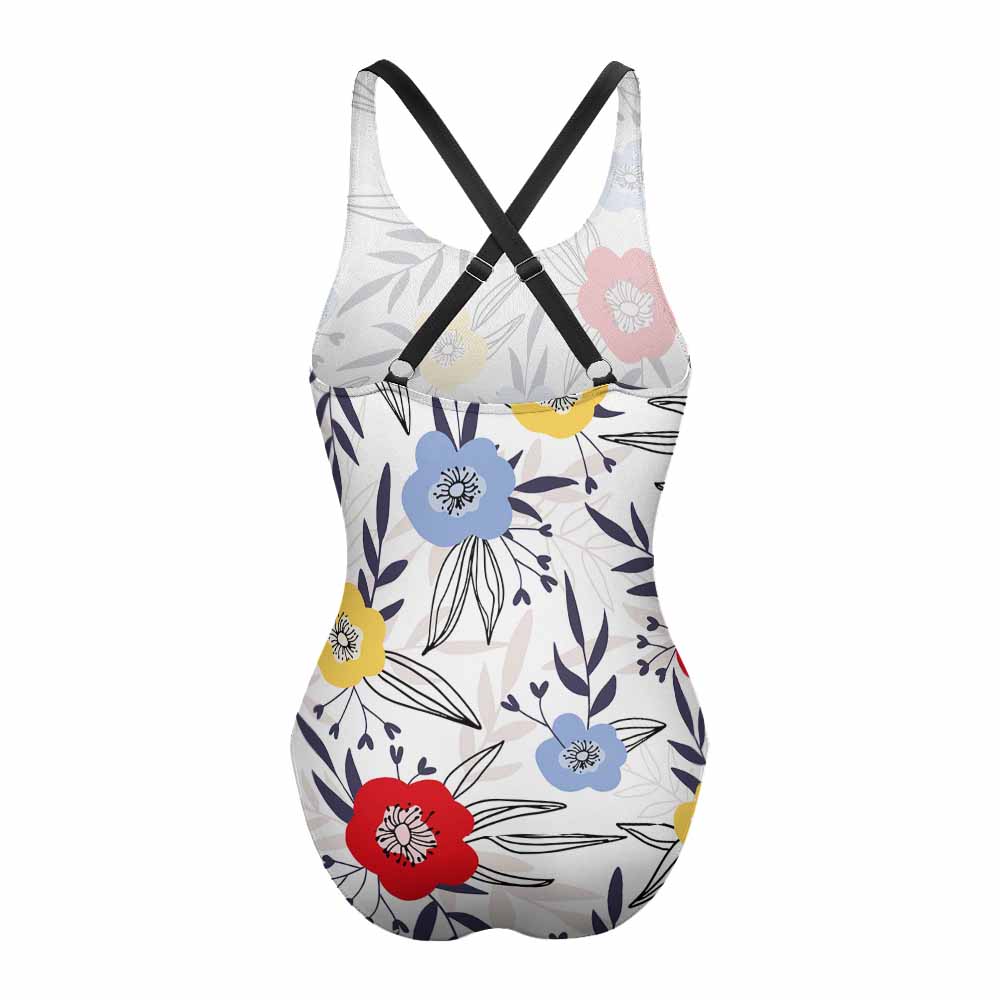 A floral swimsuit against a white background. 