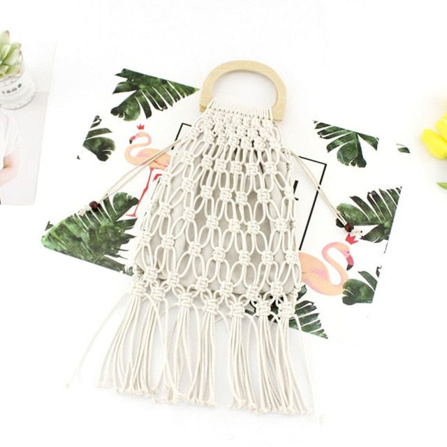 White woven handbag with wooden handles.