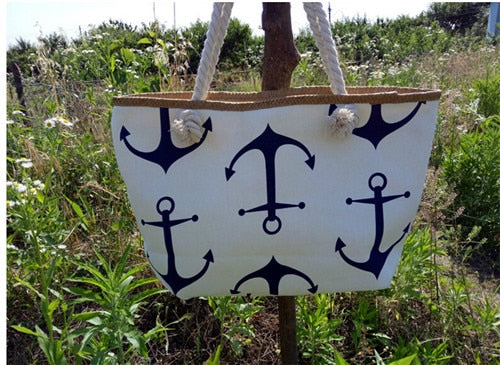 White tote bag with white anchor pattern on a white surface sold at PeachyBeanz