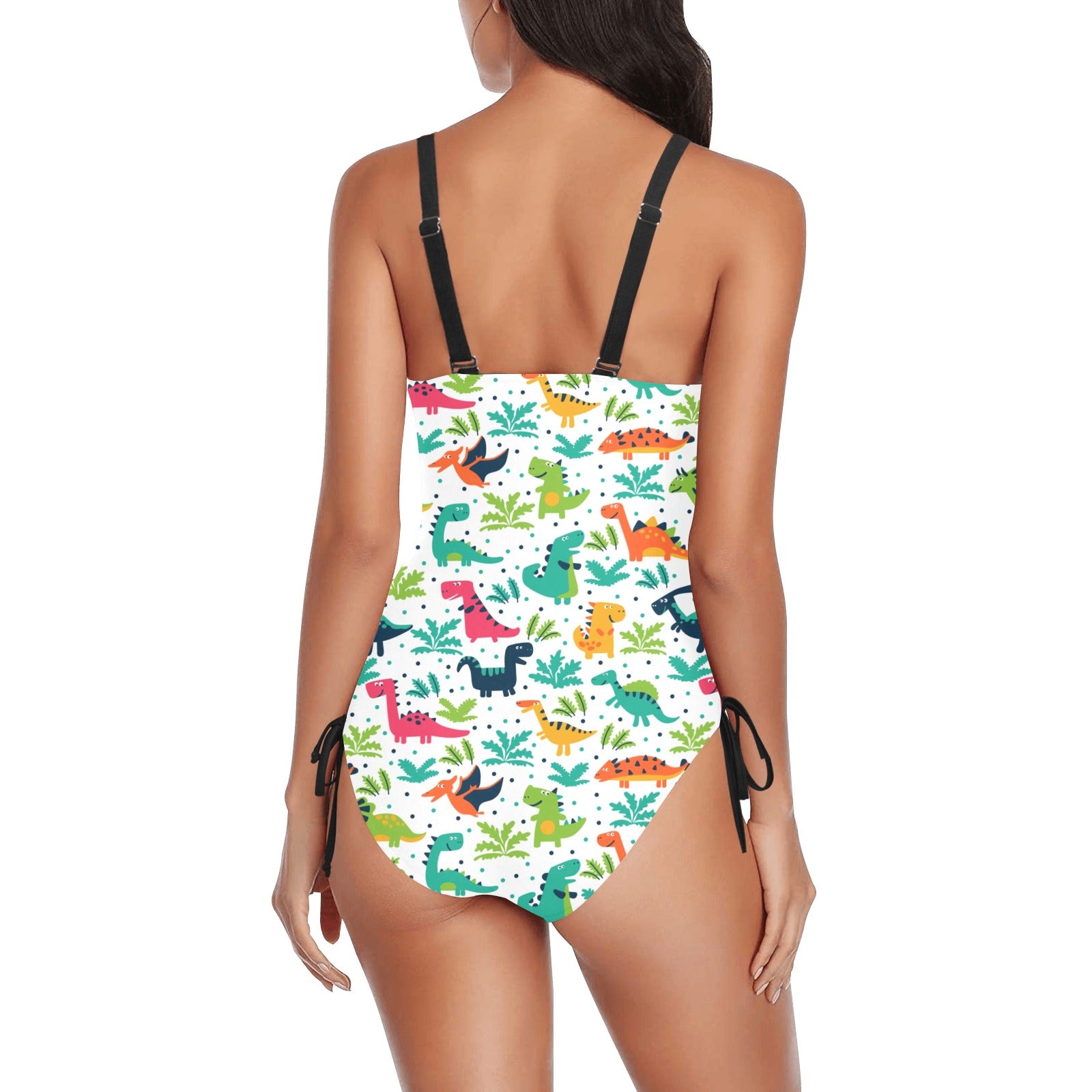 A women’s one‑piece swimsuit featuring a colorful all‑over dinosaur print, spaghetti straps, and a drawstring detail for an adjustable, flattering fit.