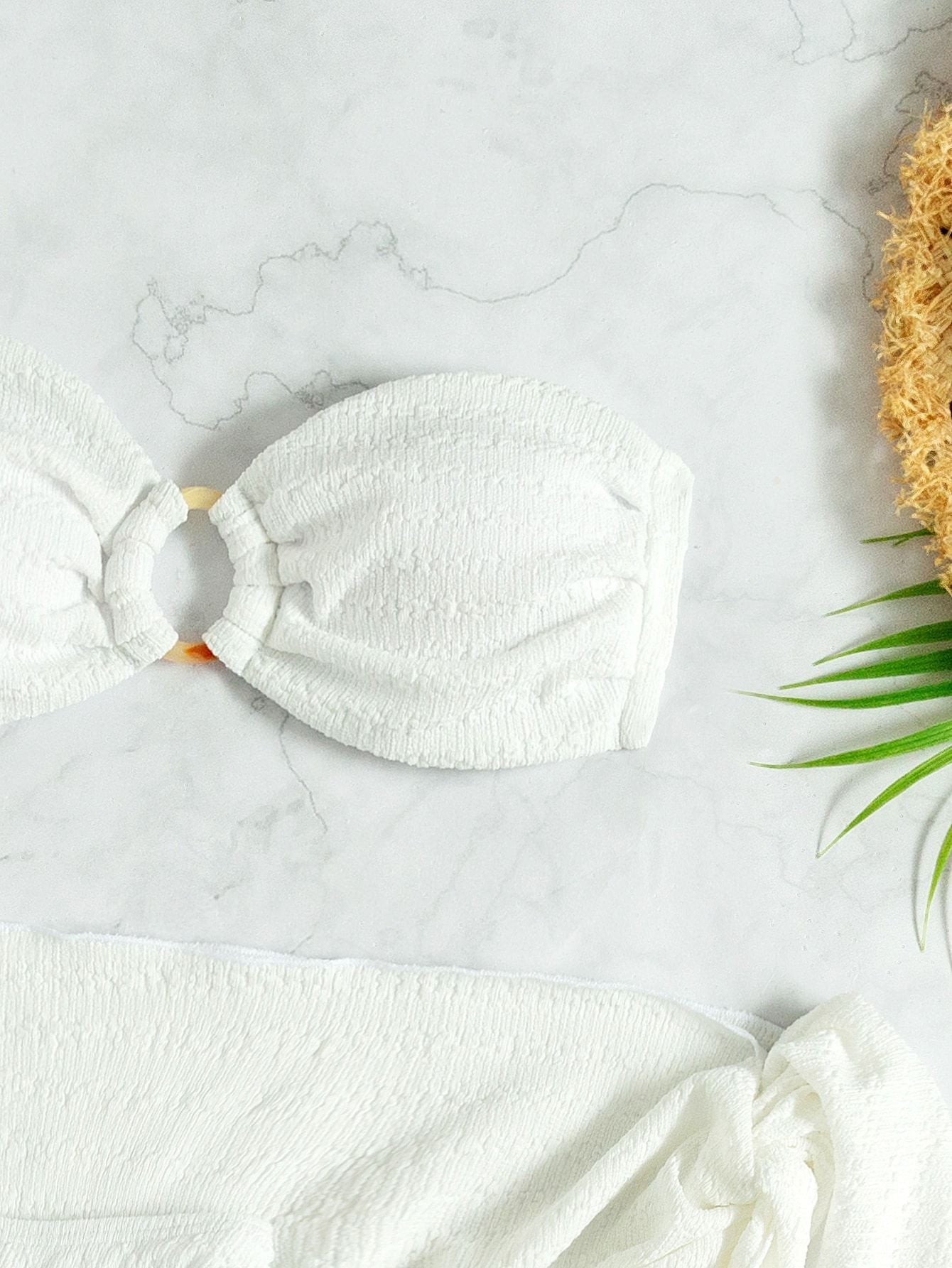 Three‑piece swimwear set in white.