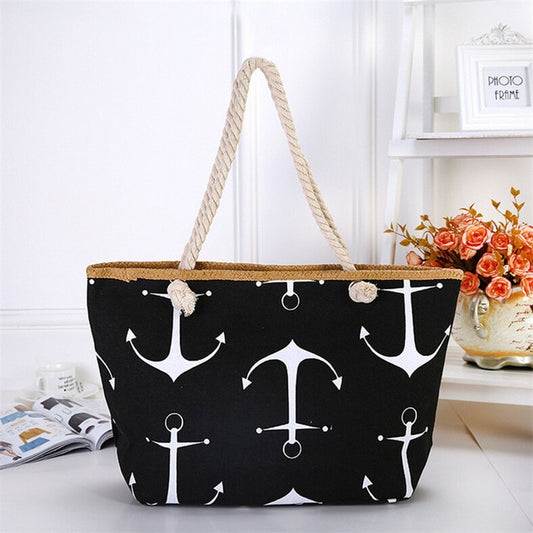 Black tote bag with white anchor pattern on a white surface sold at PeachyBeanz