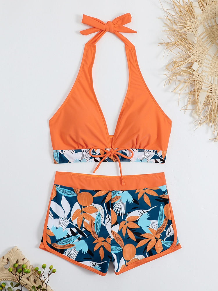 Women’s high‑waisted college‑style sports surfing swimsuit featuring a supportive tie‑back top with light padding and matching high‑waist bottoms designed for movement and comfort.