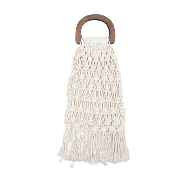 White woven handbag with wooden handles.