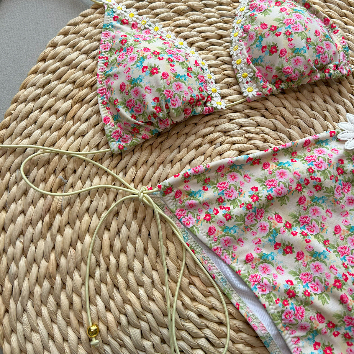 Floral bikini set on a woven surface