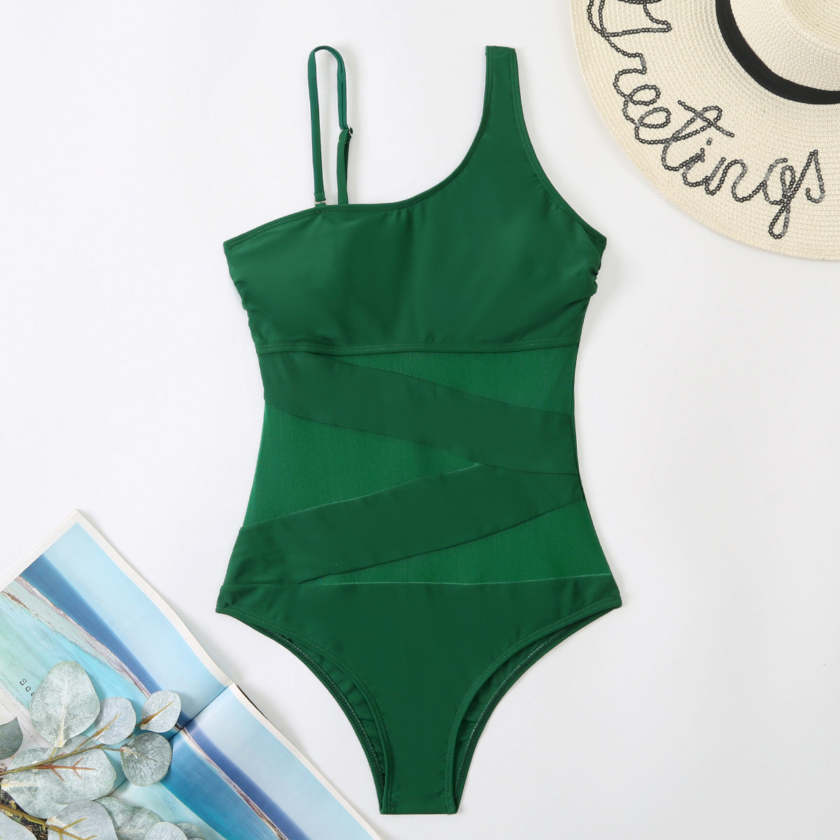 Green swimsuit with a tropical background sold at PeachyBeanz