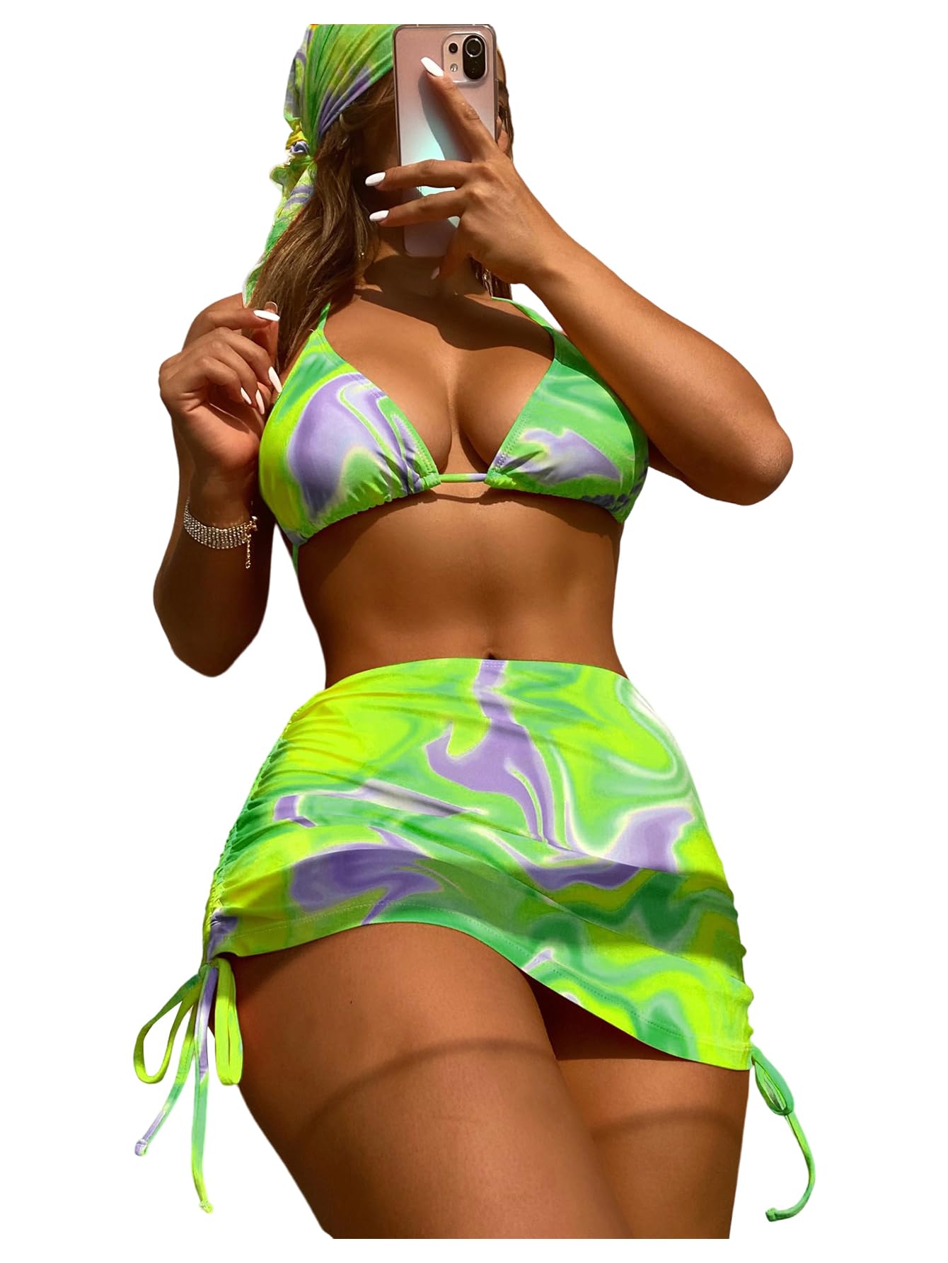 Person wearing a green and purple bikini with matching wrap on a white background