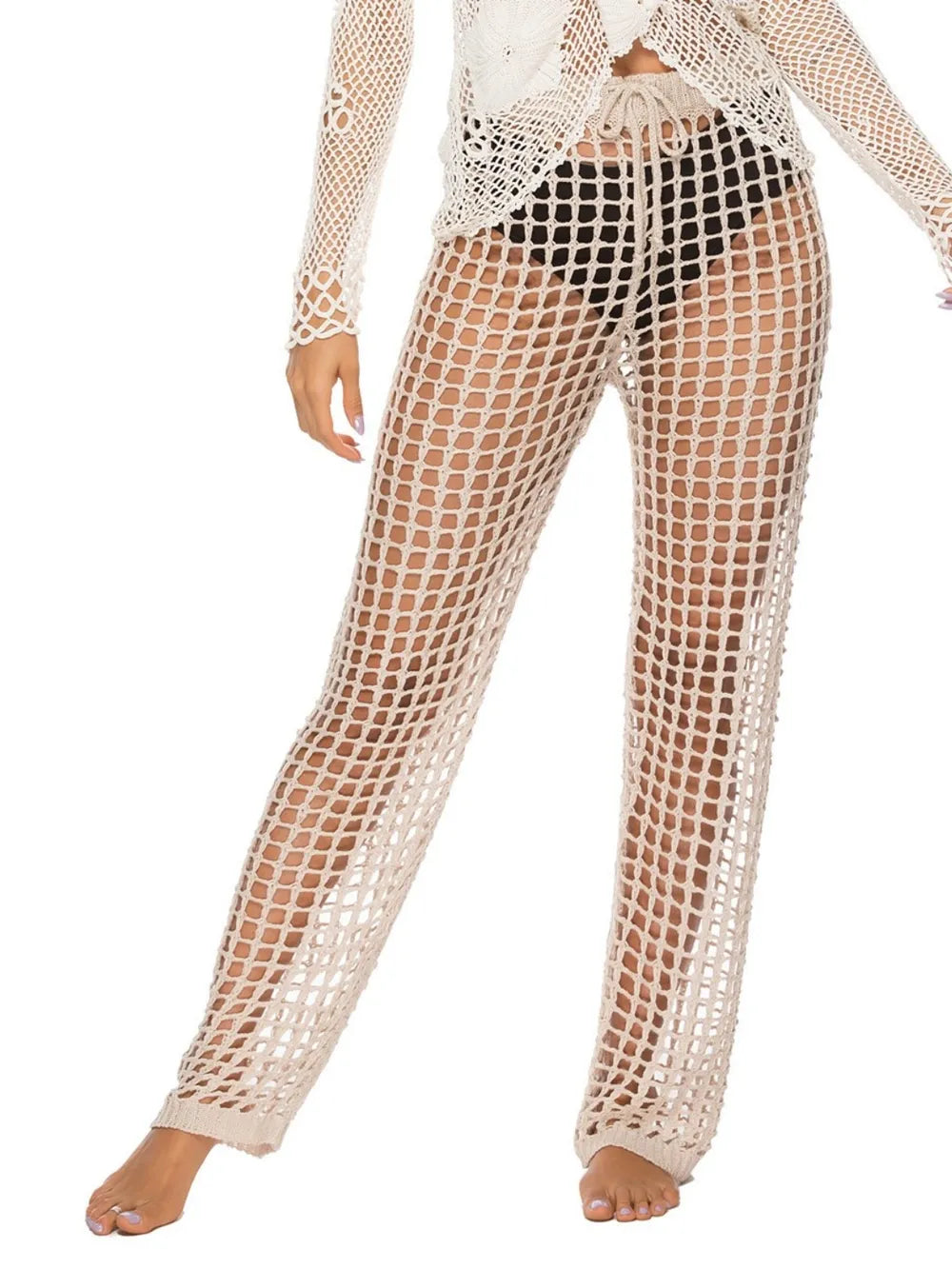 High‑waist cutout swim cover‑up pants with tie‑up closure in a solid color, displayed on a plain background.