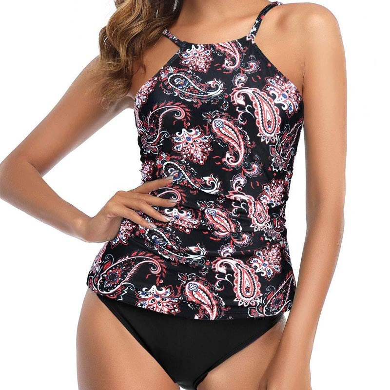 Woman wearing a multi-colored design swimsuit against a white background.