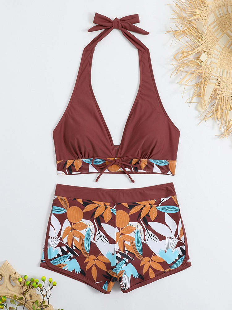 Women’s high‑waisted college‑style sports surfing swimsuit featuring a supportive tie‑back top with light padding and matching high‑waist bottoms designed for movement and comfort.