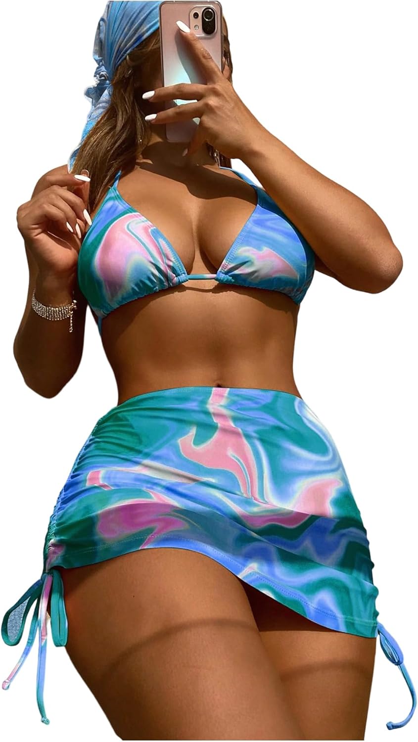 Woman wearing a colorful bikini with a matching skirt on a white background