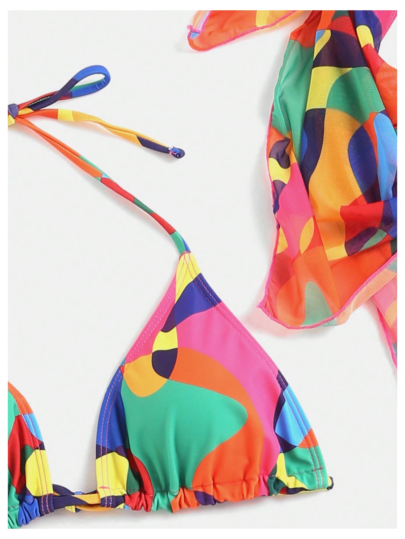 Colorful bikini set with a matching scarf on a white background