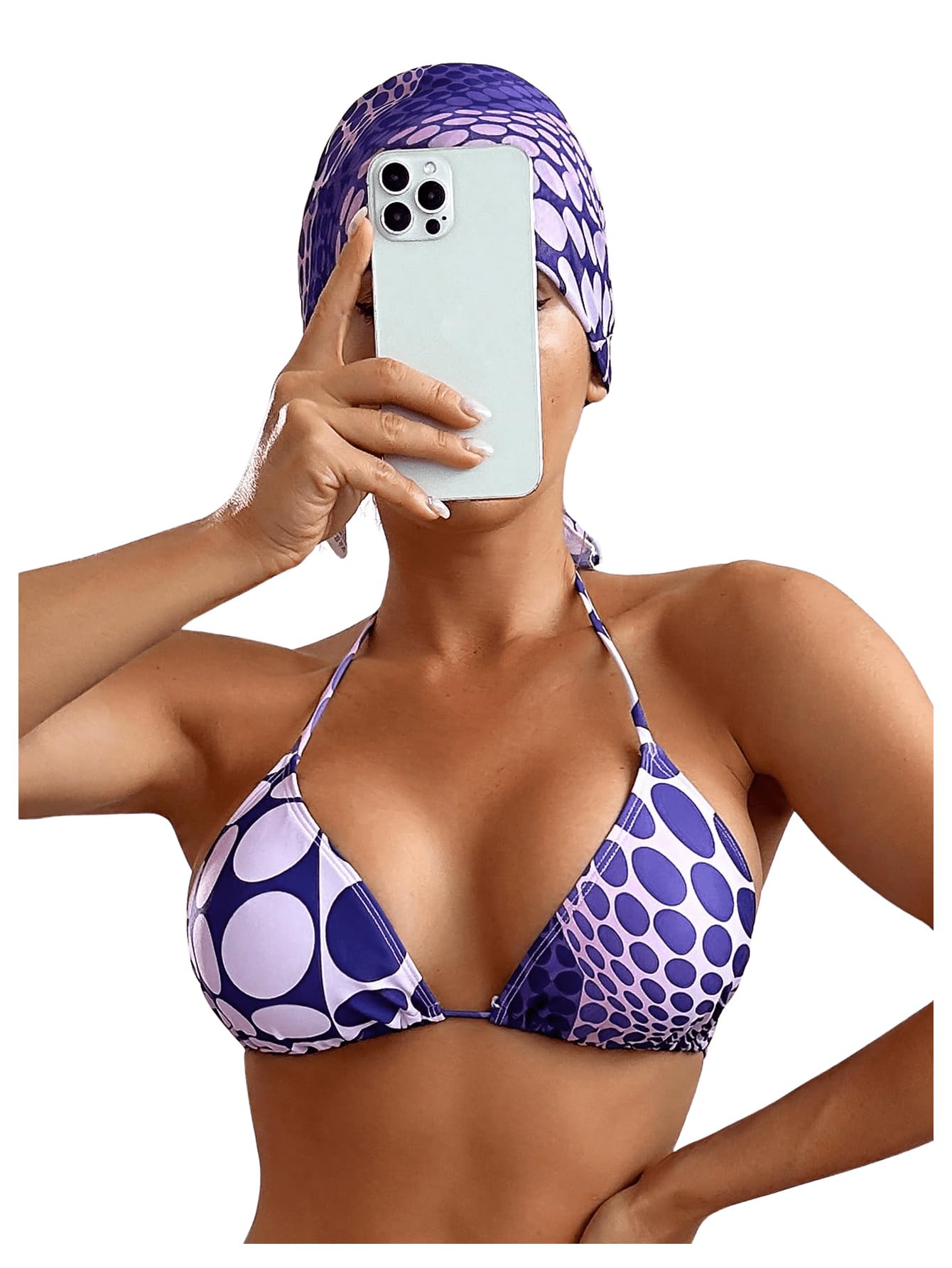 Person wearing a purple and white polka dot bikini taking a selfie.