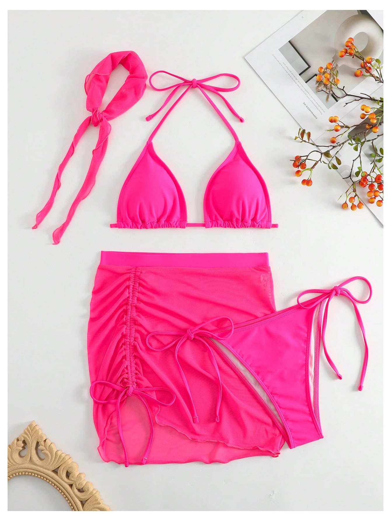 Pink bikini set with matching headband on a light gray background