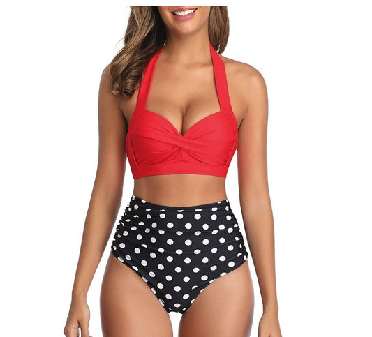 Woman wearing a multi-colored design swimsuit against a white background.