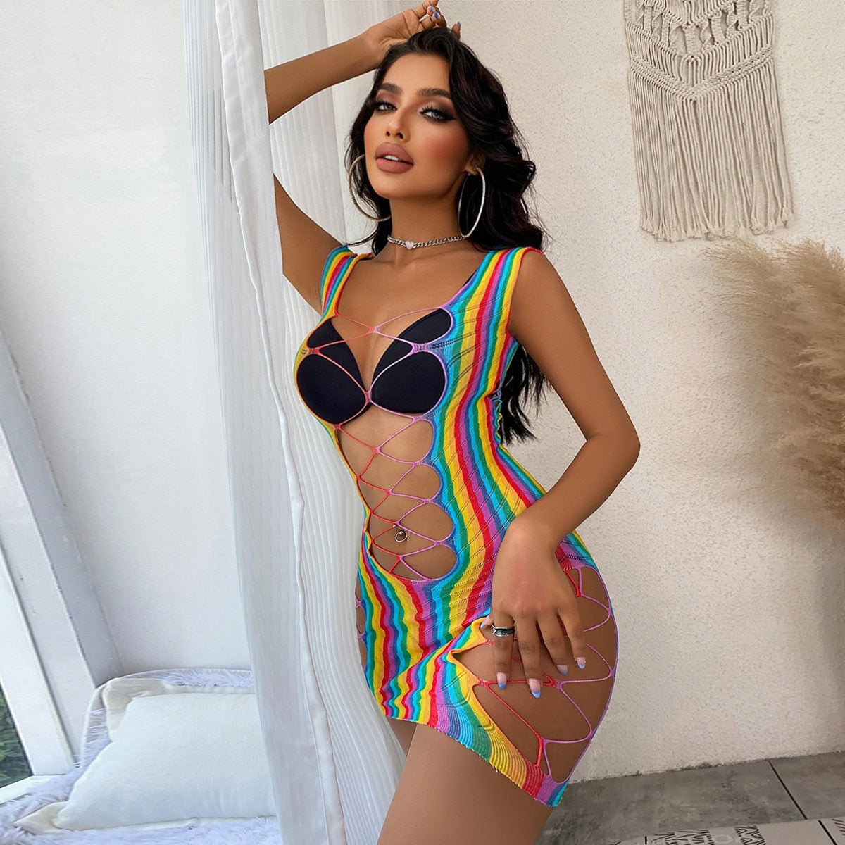 Colorful fishnet coverup with geometric cutouts and cropped silhouette.