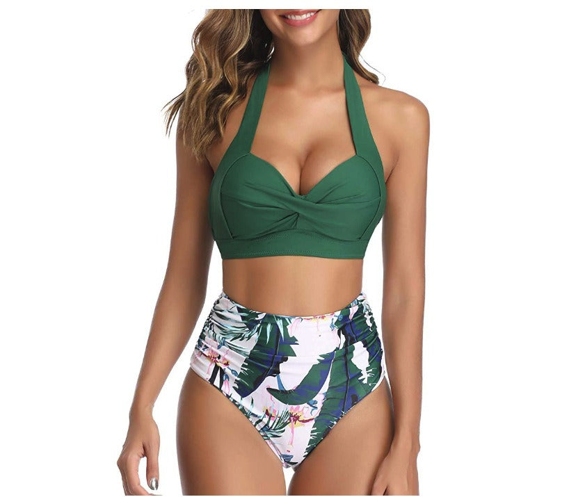 Woman wearing a multi-colored design swimsuit against a white background.