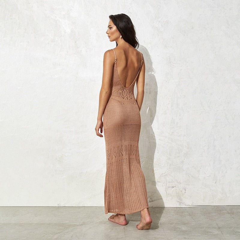 This knitted cover up blends airy texture with a streamlined shape for a modern resort look. 