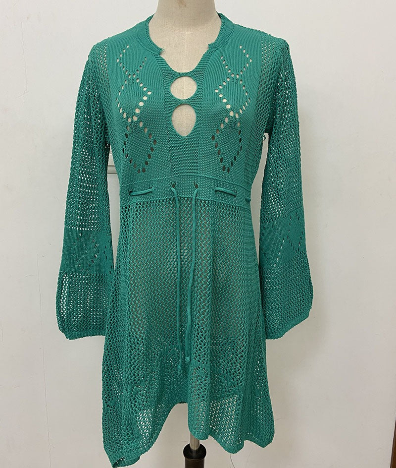 Lightweight flared beach cover shirt with hollow cutout pattern and relaxed fit.