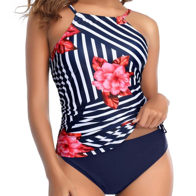 Woman wearing a multi-colored design swimsuit against a white background.