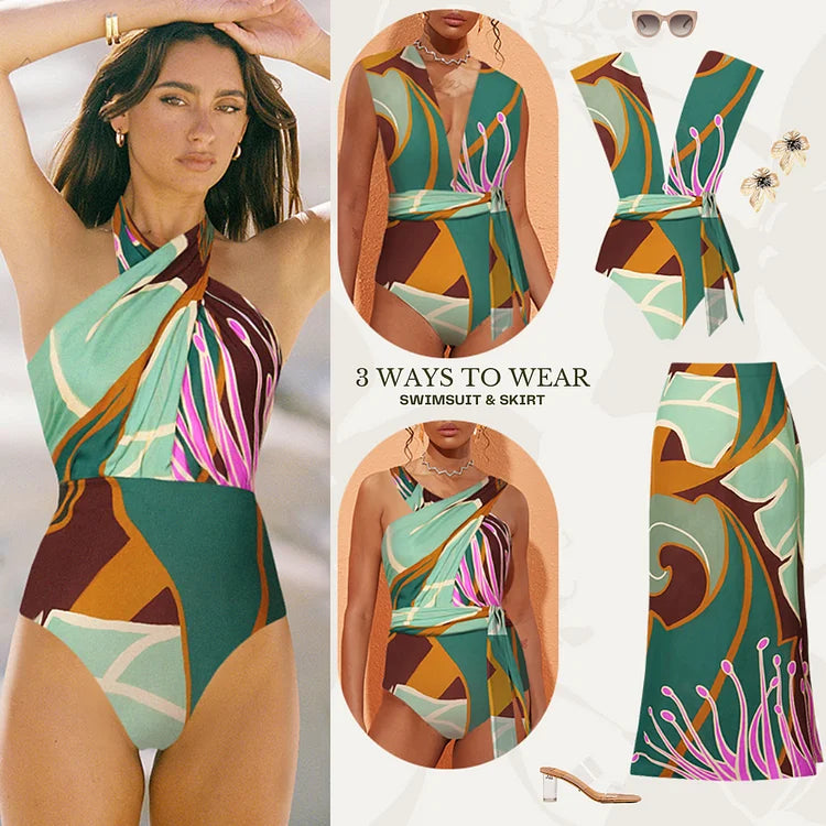 Halter printed one‑piece swimsuit with matching wrap skirt; plaid floral print in soft blue and brown.